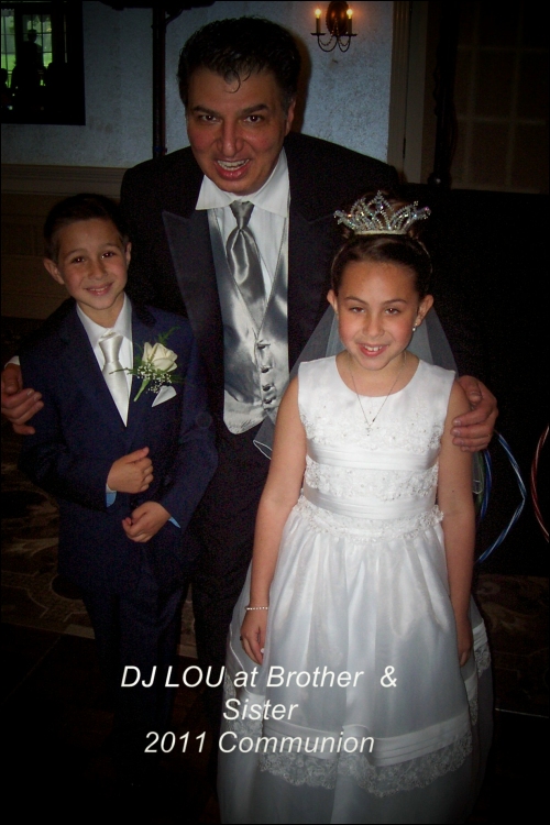 Lou with the stars of a 2011 brother and sister Communion celebration.