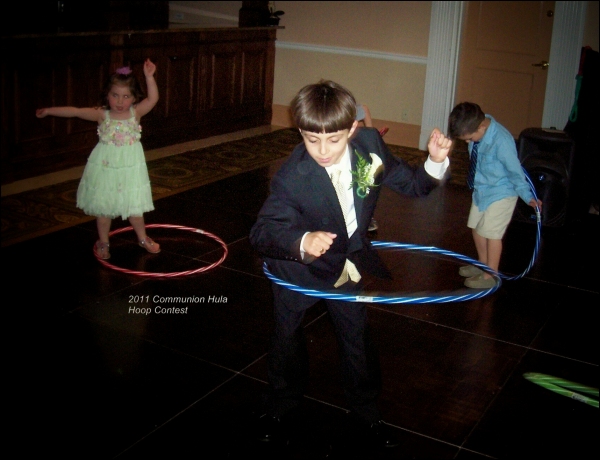 Lou makes sure the children have a good time at a recent Communion celebration.