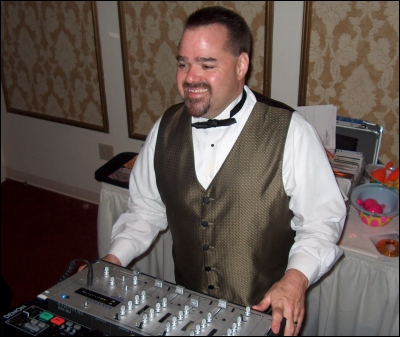Emcee Rob Murray keeps watch over the dance floor to make sure everyone is having a good&nbsp;time.